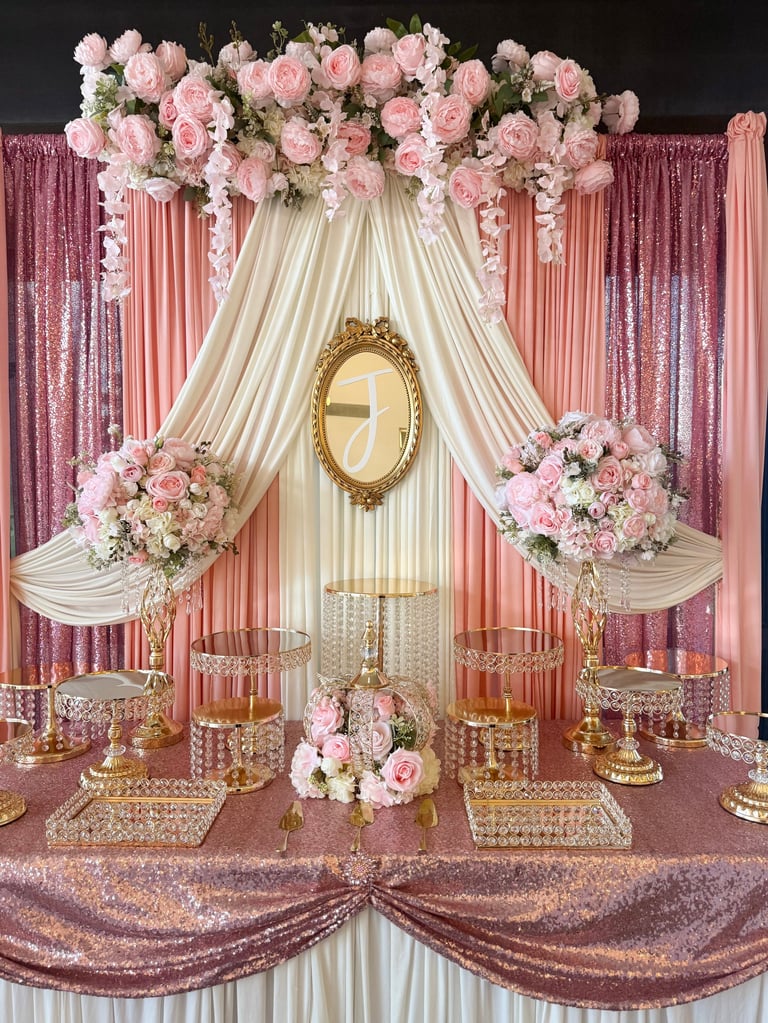 Elegant wedding altar with pink roses, cream drapes, gold oval mirror, and sequined backdrop in mauve and blush tones