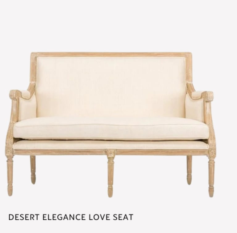 Desert Elegance love seat with cream cushions and natural wood frame on a light background