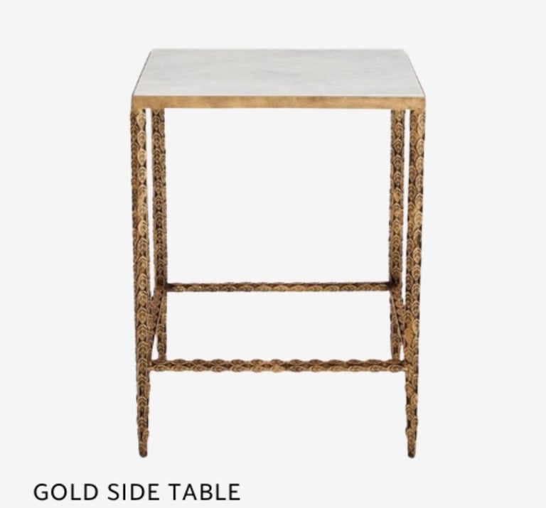 Gold side table with marble top, featuring metal frame and shelf storage