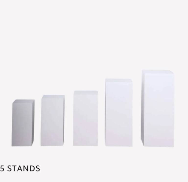 Five white rectangular display stands arranged in increasing height from left to right