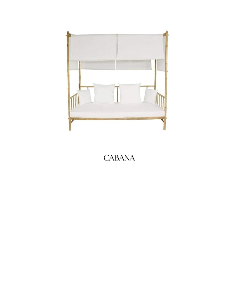 Cabana four-poster bed with natural wood frame, white bedding, and sheer canopy panels